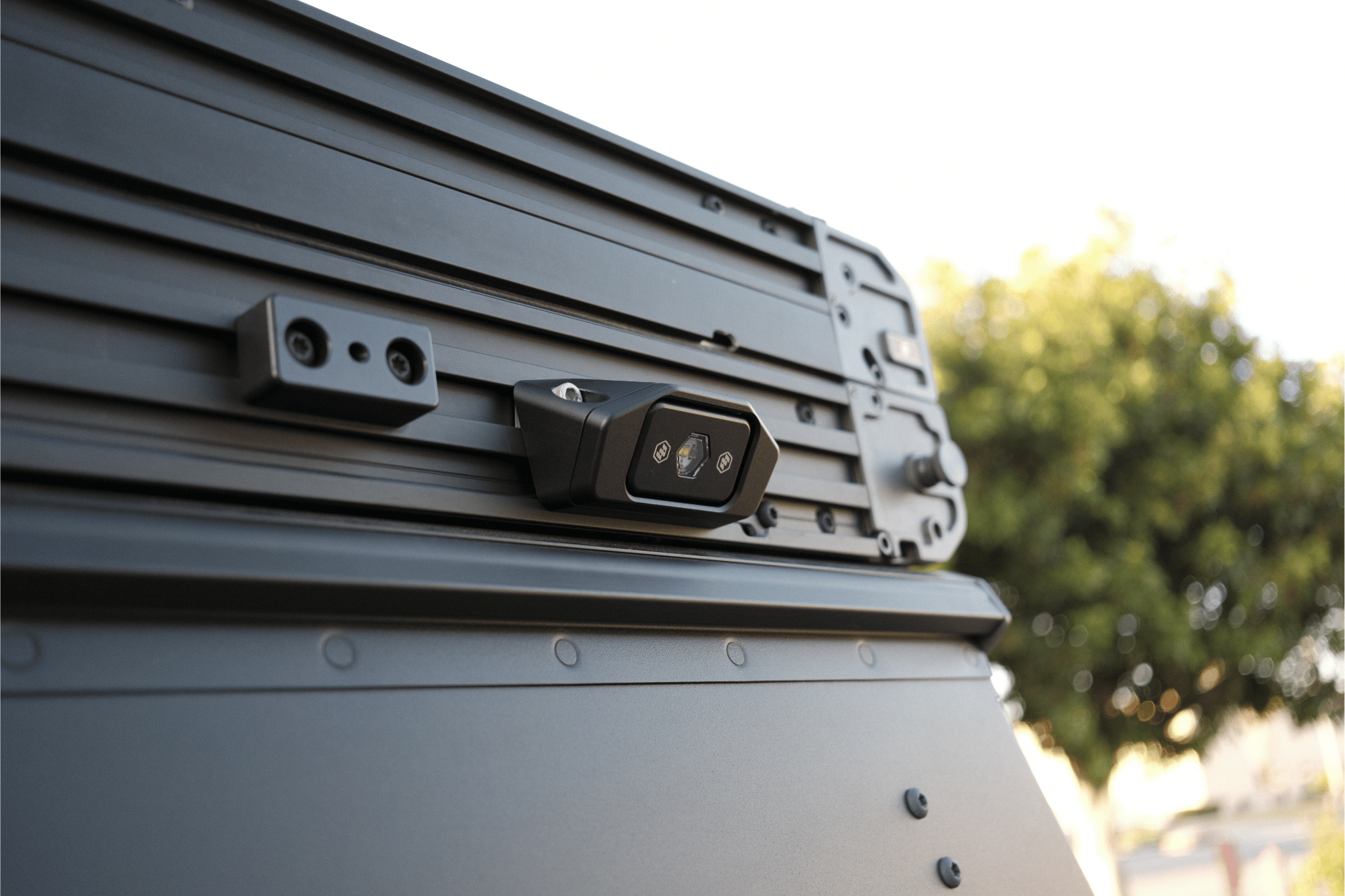 Roof rack system on a vehicle with a blurred natural background