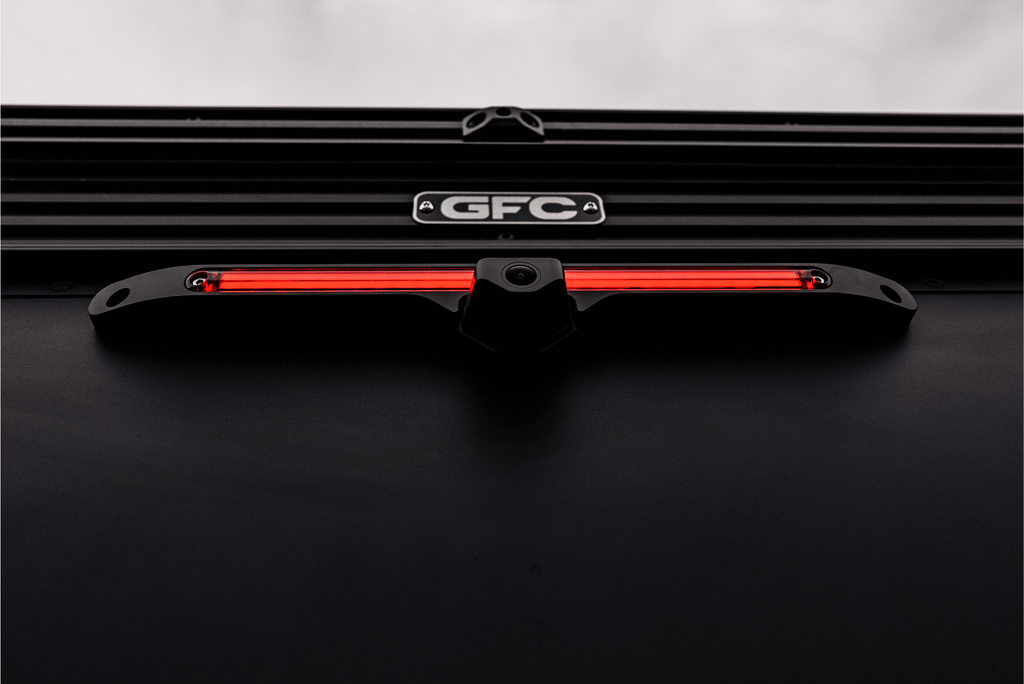 Black car grille with red LED light bar and 'GFC' logo on a dark background